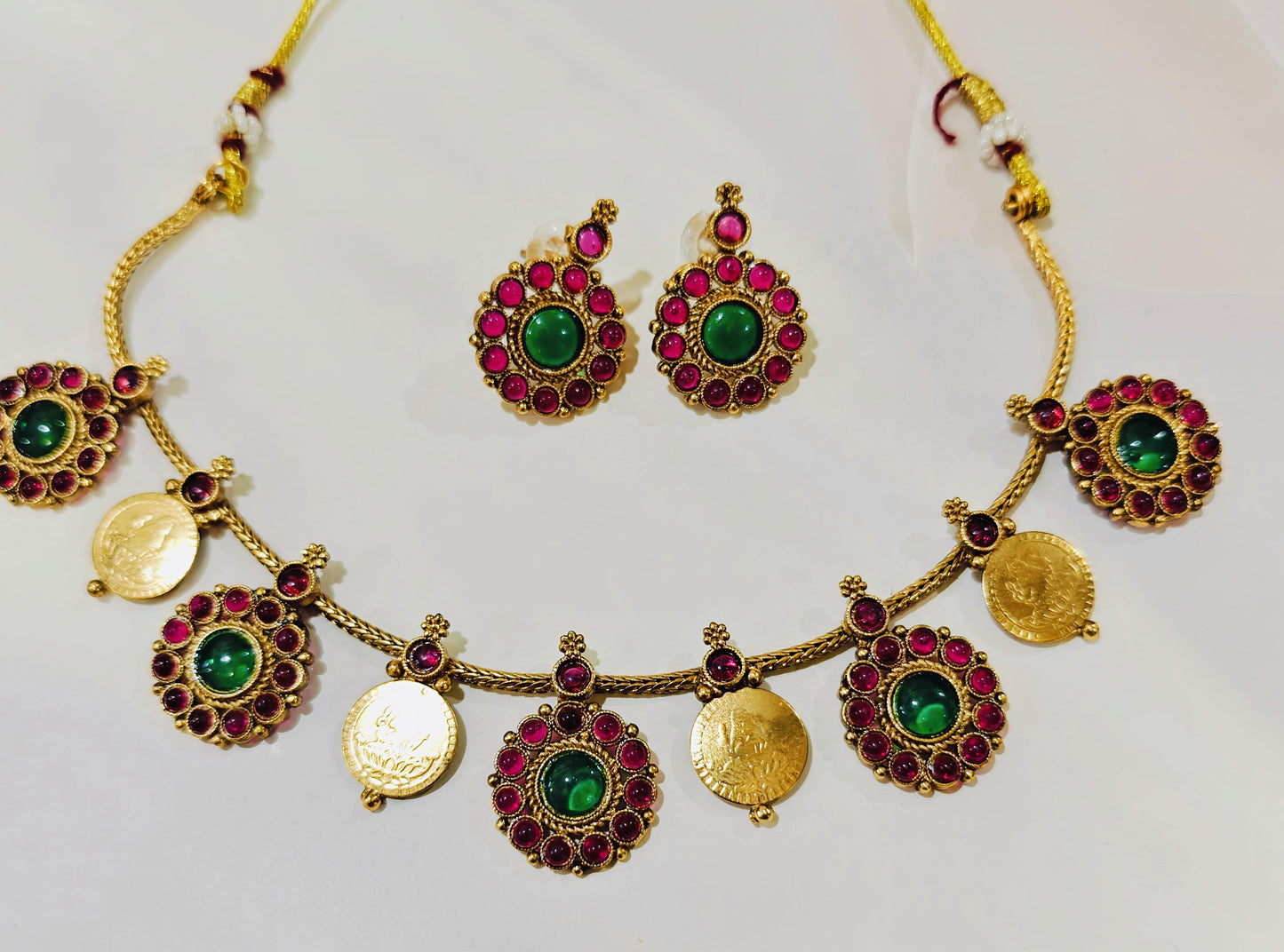 Lakshmi Coin Necklace Set With Green Center Stones And Ruby-like Red Stones.