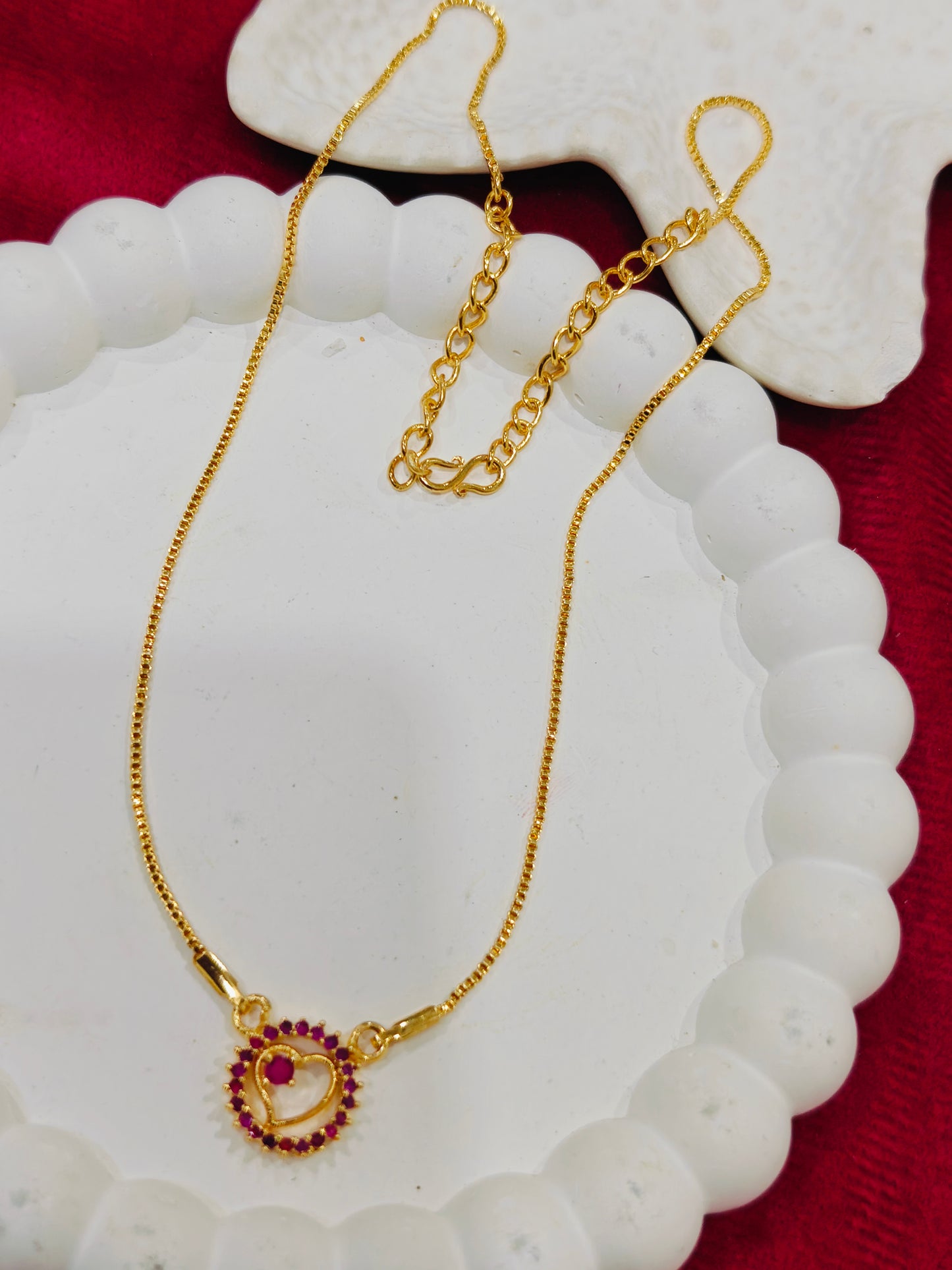 Gold Plated Necklace featuring a minimal heart -shaped pendant