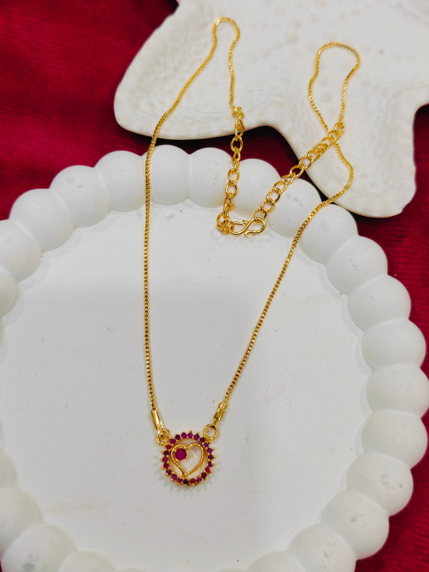 Gold Plated Necklace featuring a minimal heart -shaped pendant